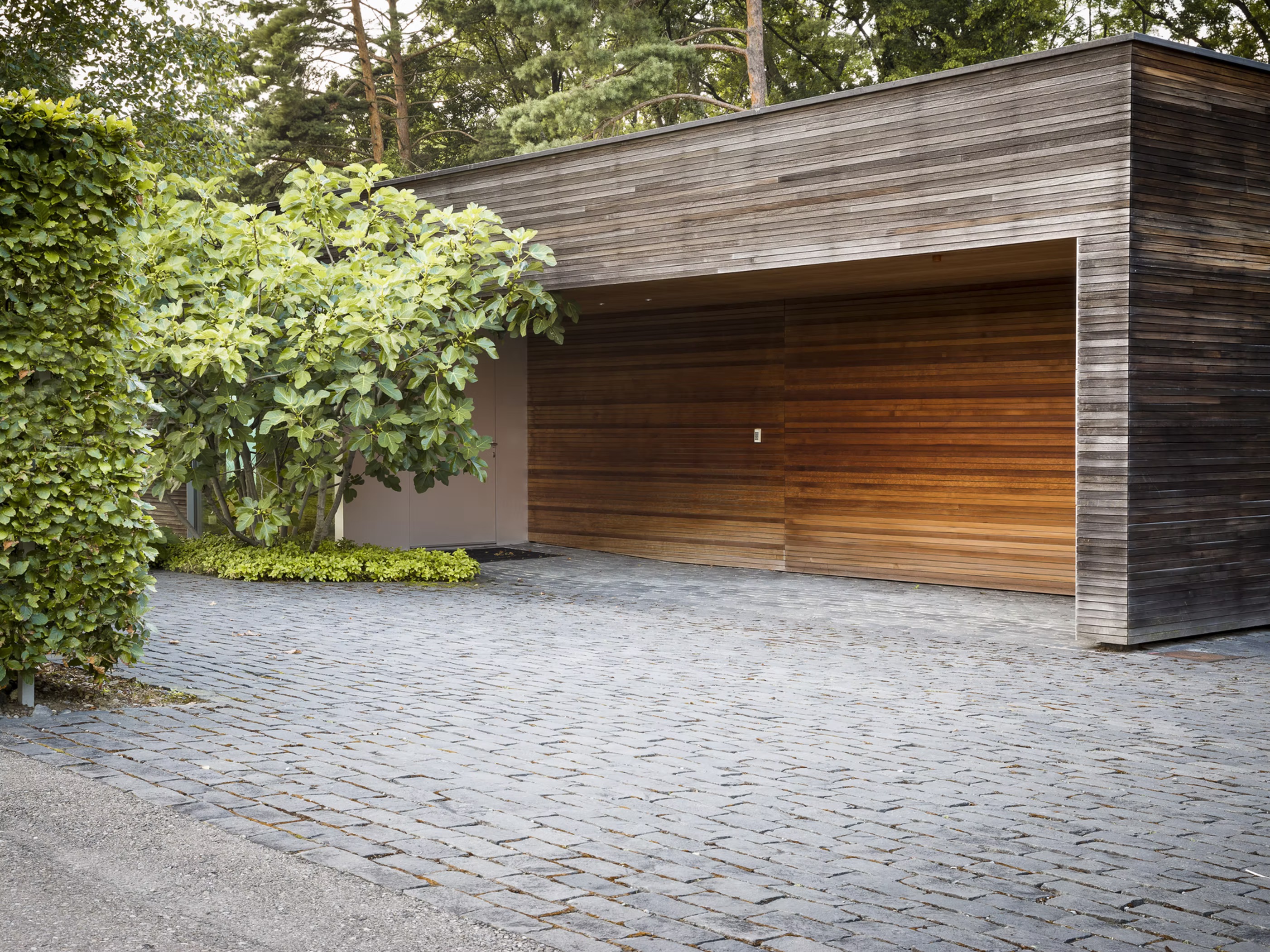 A garage and driveway, part of a wider building project